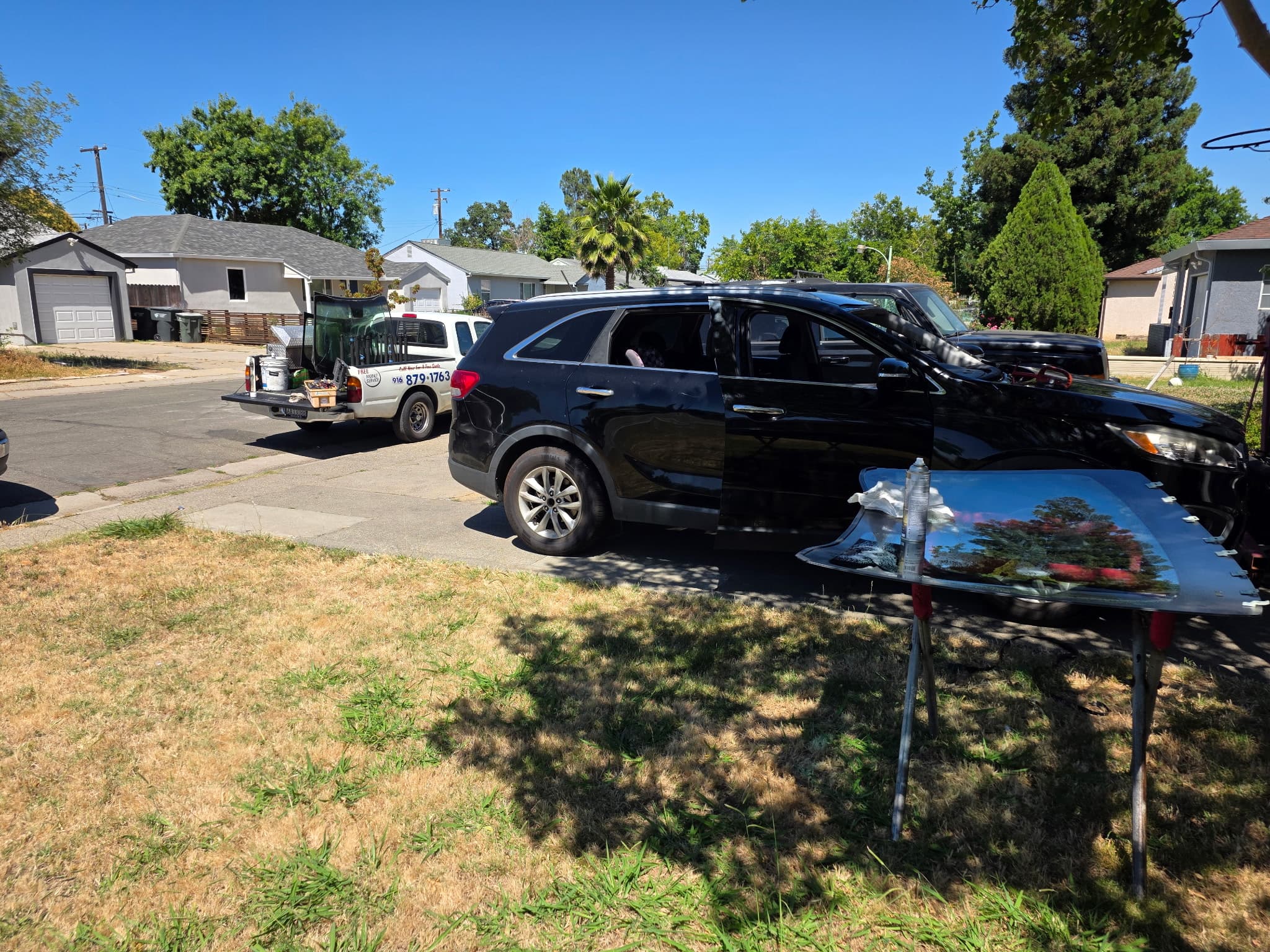 Driveway windshield install with the branded truck