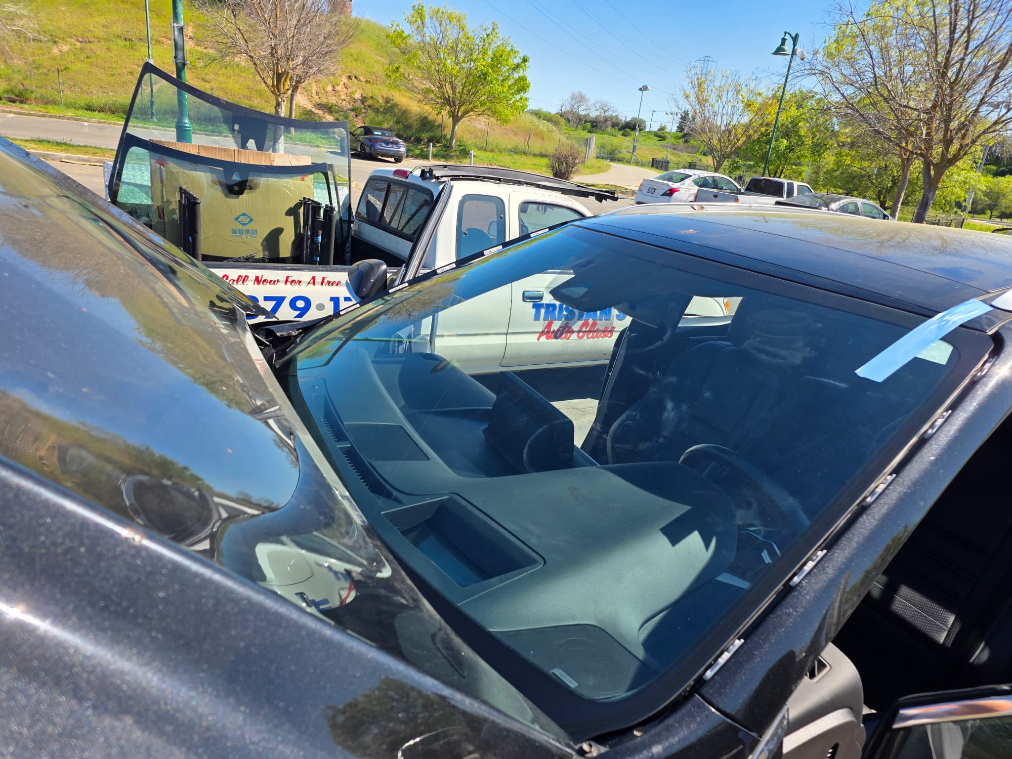 Fresh windshield install showing the Tristan decal